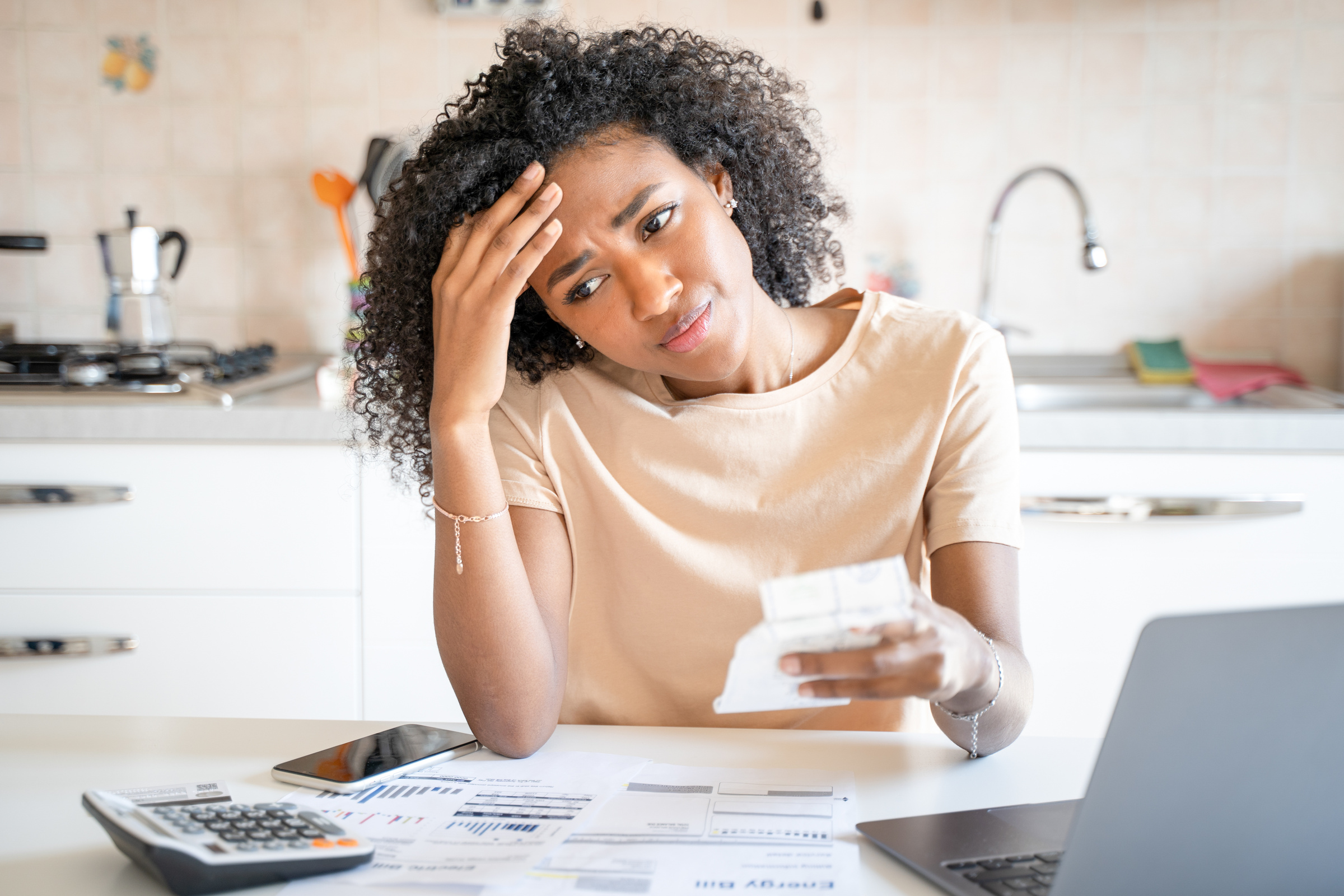 One sad black woman with home finances problem